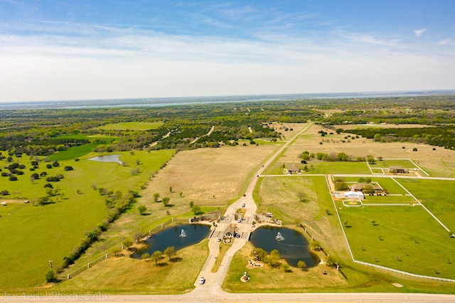 bird's eye view featuring a water view and a rural view