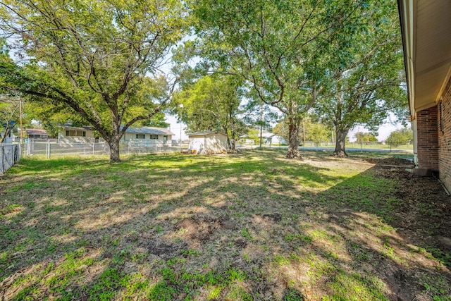 view of yard with a storage shed