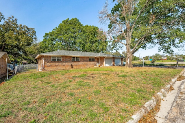 exterior space featuring a front lawn and a garage