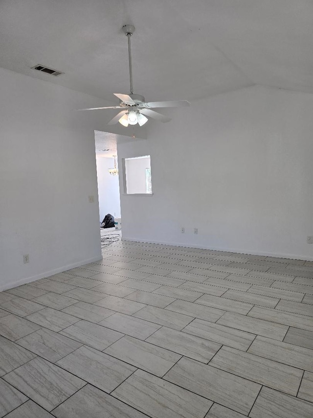 unfurnished room featuring ceiling fan and vaulted ceiling