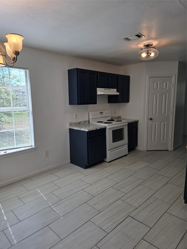 kitchen with white electric range oven, light stone countertops, and a textured ceiling