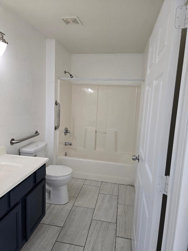 full bathroom with vanity, toilet, and tub / shower combination