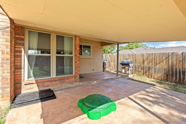 view of patio featuring a grill