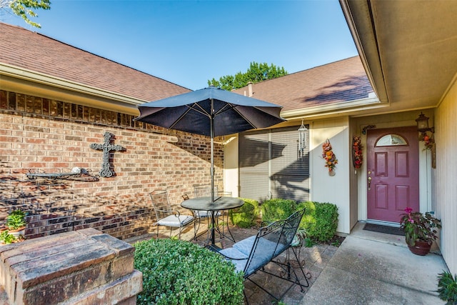 entrance to property with a patio