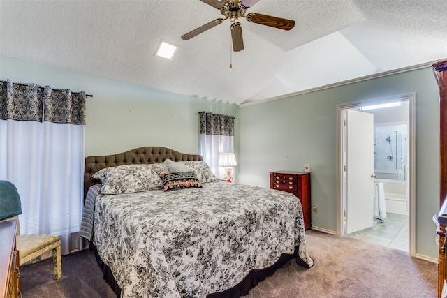 bedroom featuring ceiling fan, a textured ceiling, carpet flooring, vaulted ceiling, and ensuite bathroom