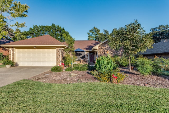 view of front of house with a front lawn and a garage