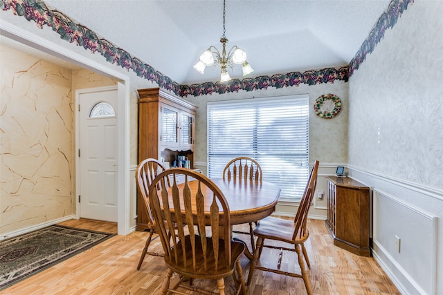 dining room with ceiling fan, a textured ceiling, and dark tile patterned floors