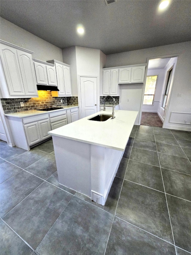 16536 County Road 221, Forney, TX 75126 - kitchen featuring white cabinetry, a kitchen island with sink, sink, and tasteful backsplash