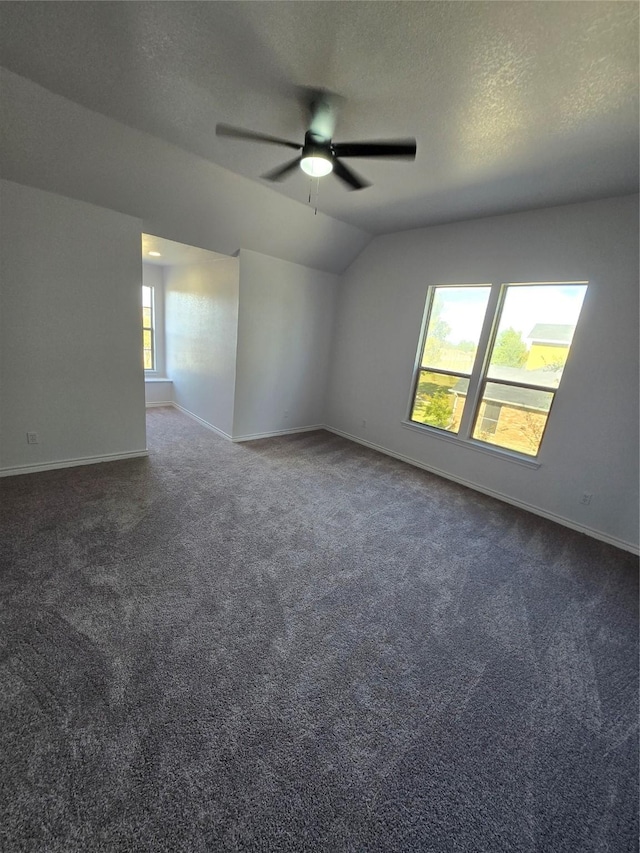16536 County Road 221, Forney, TX 75126 - carpeted empty room with ceiling fan, vaulted ceiling, and a textured ceiling