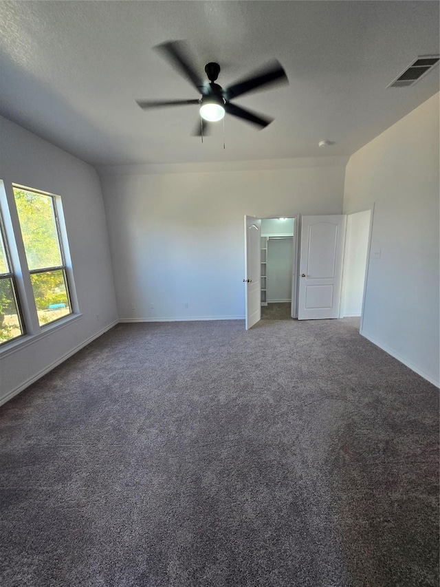 16536 County Road 221, Forney, TX 75126 - carpeted spare room featuring vaulted ceiling, a textured ceiling, and ceiling fan