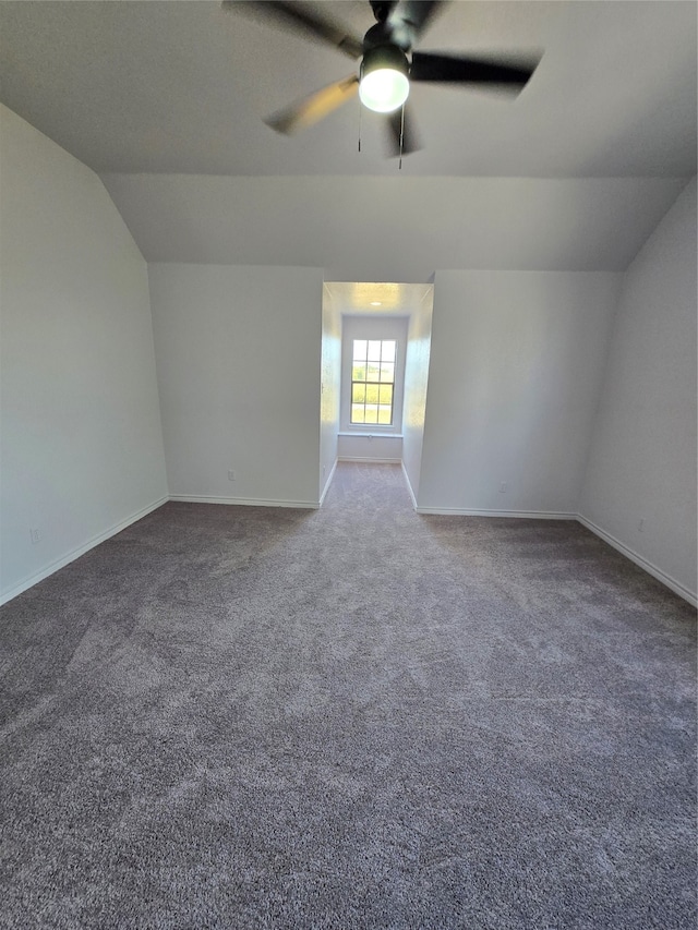 bonus room with lofted ceiling, carpet flooring, and ceiling fan