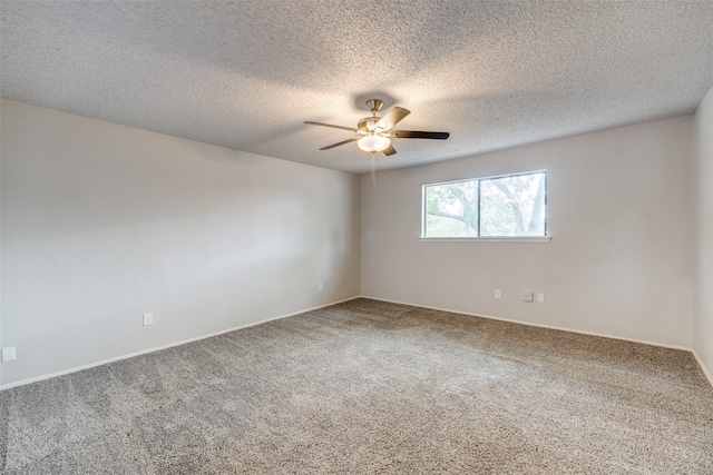 carpeted empty room featuring a textured ceiling and ceiling fan