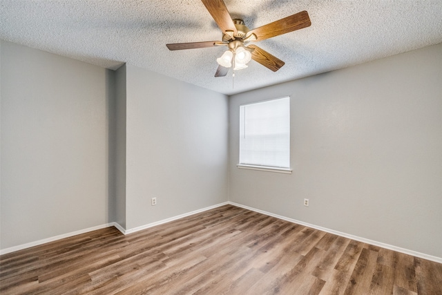 spare room featuring hardwood / wood-style floors, a textured ceiling, and ceiling fan