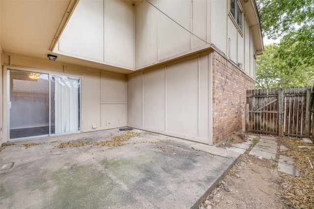 view of side of property featuring a patio area