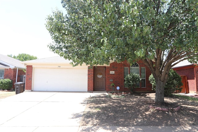 obstructed view of property featuring a garage, concrete driveway, and brick siding