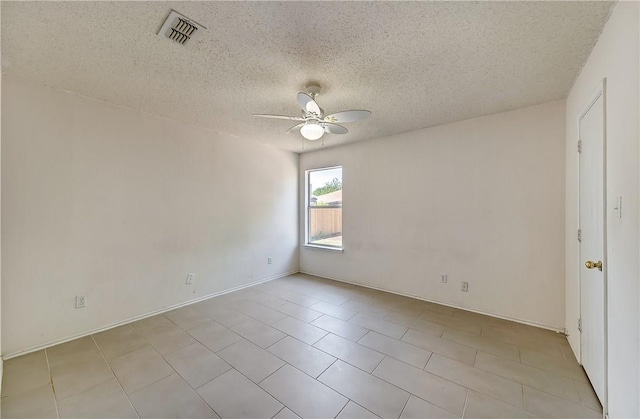 spare room featuring ceiling fan and a textured ceiling