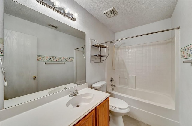 full bathroom with tile patterned flooring, vanity, toilet, bathing tub / shower combination, and a textured ceiling