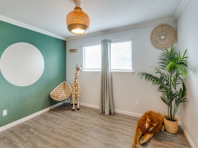 living area featuring crown molding and light wood-type flooring