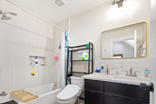 full bathroom featuring vanity, toilet, and shower / tub combo with curtain