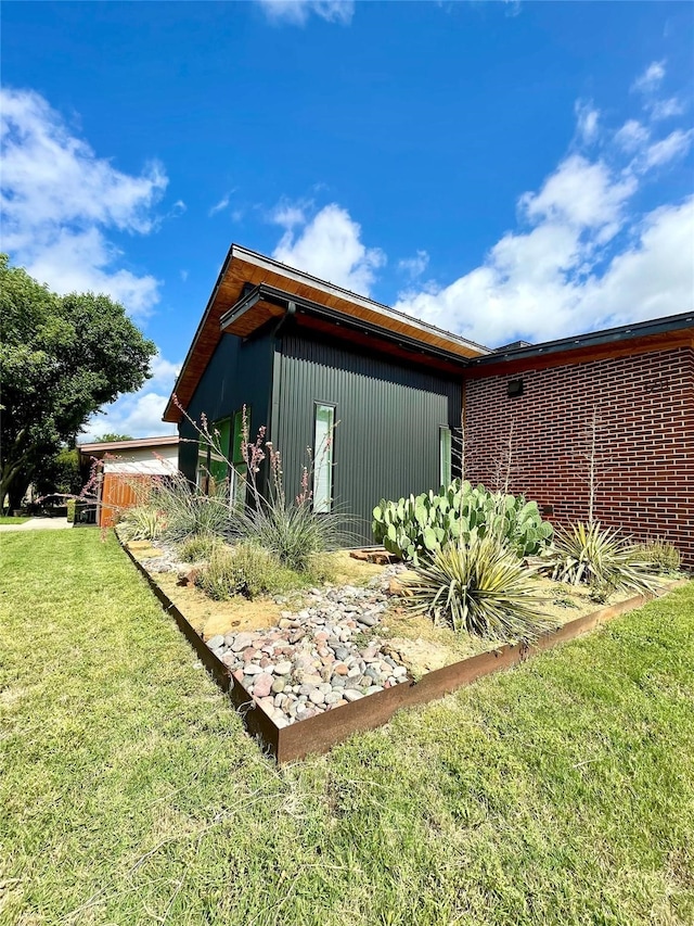 view of property exterior with a yard