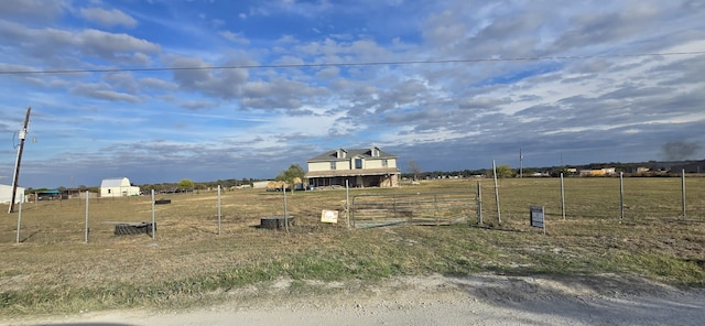 view of yard with a rural view