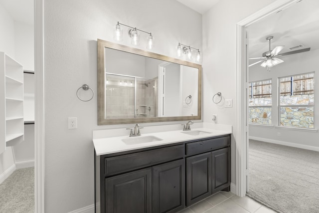 bathroom featuring vanity, ceiling fan, tile patterned floors, and an enclosed shower