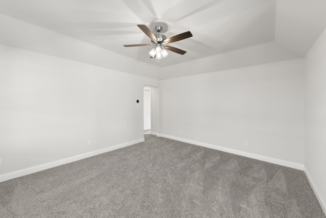 carpeted empty room featuring lofted ceiling and ceiling fan