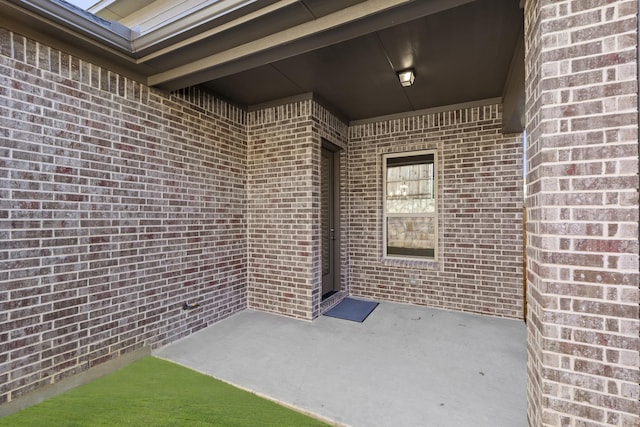 property entrance with a patio