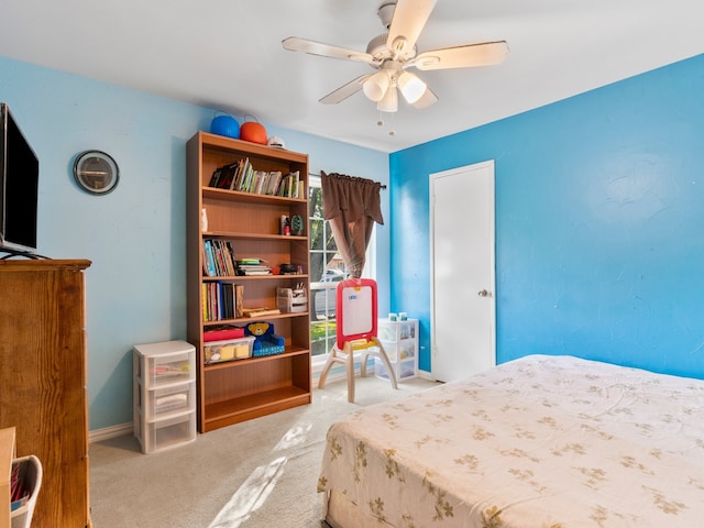 carpeted bedroom with ceiling fan