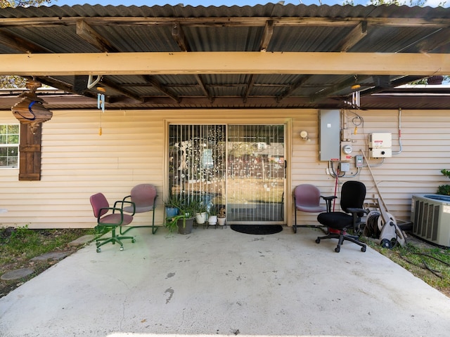 view of patio / terrace with central AC and electric panel