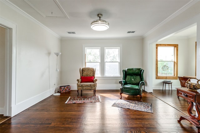 sitting room featuring dark hardwood / wood-style floors and crown molding