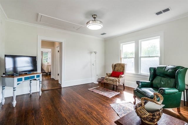 sitting room featuring dark hardwood / wood-style floors and ornamental molding