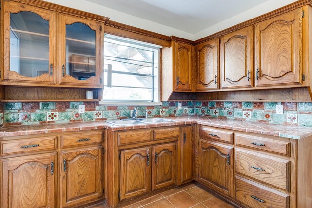 726 S Clinton Ave, Dallas, TX 75208 - kitchen with a sink, tile counters, and tasteful backsplash