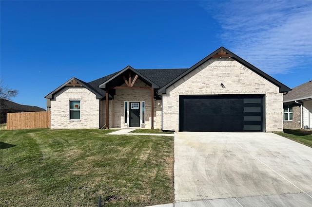 view of front of home with concrete driveway, an attached garage, fence, a front yard, and brick siding