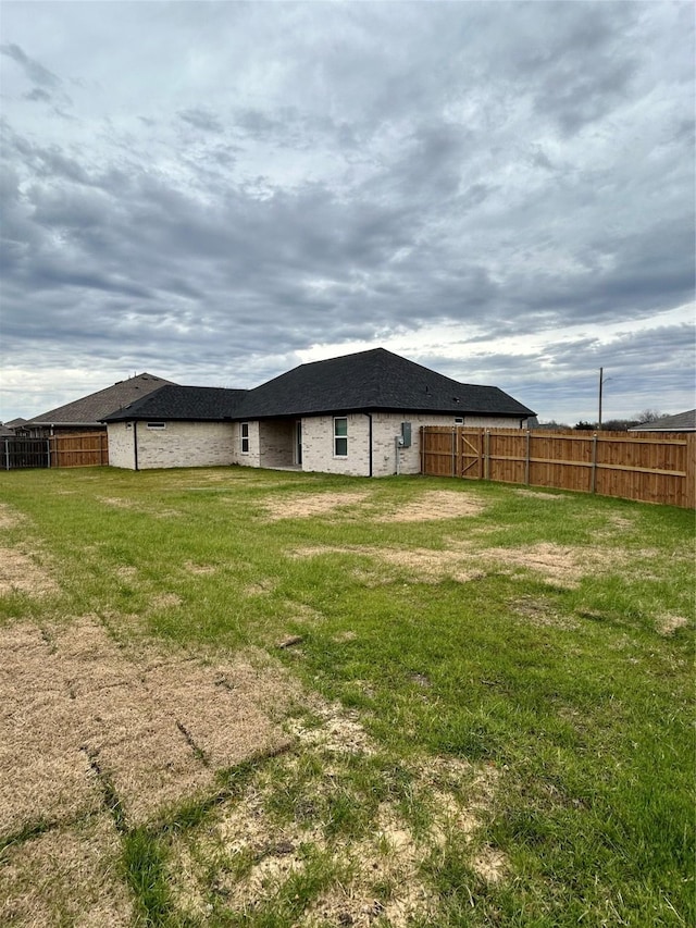 view of yard with a fenced backyard