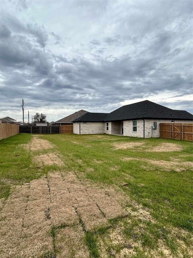 view of yard featuring a fenced backyard