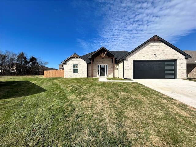 view of front of property featuring a garage, fence, a front lawn, and concrete driveway