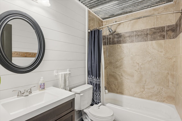 full bathroom with toilet, wood walls, vanity, and shower / tub combo