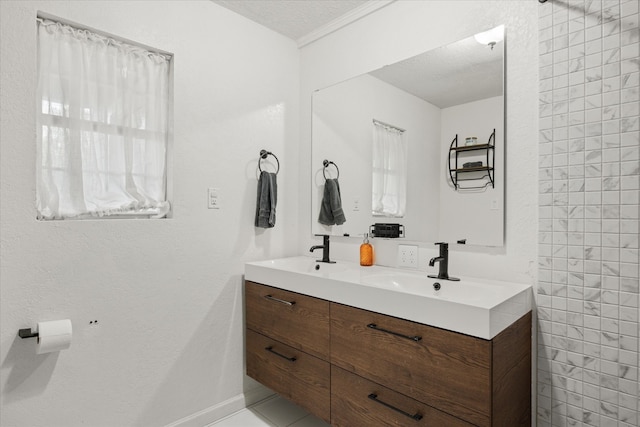 bathroom with vanity and a textured ceiling