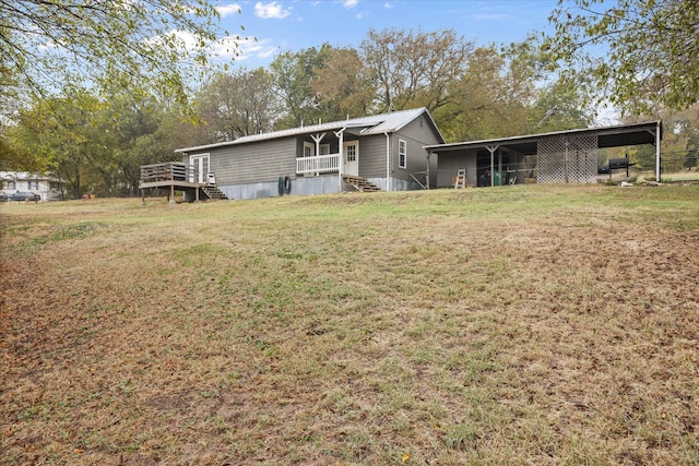 exterior space featuring a carport and a lawn