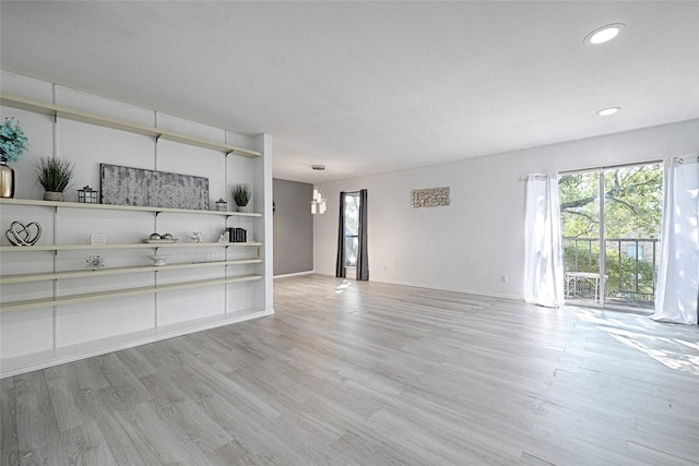 unfurnished living room featuring light hardwood / wood-style floors