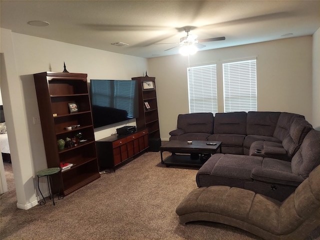 living room featuring carpet and ceiling fan