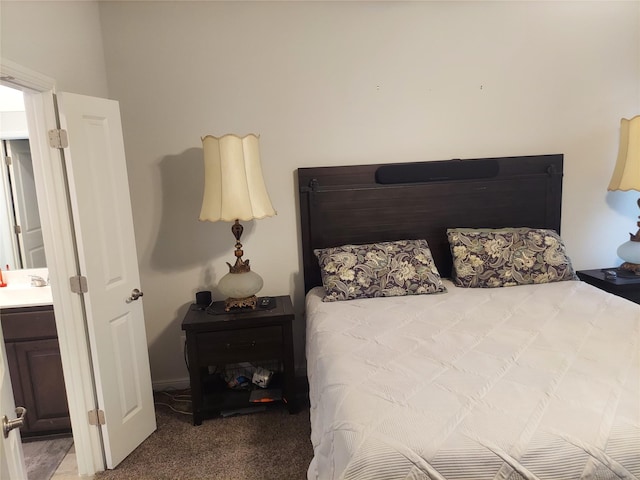 carpeted bedroom featuring sink