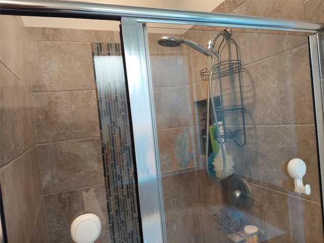 bathroom featuring an enclosed shower