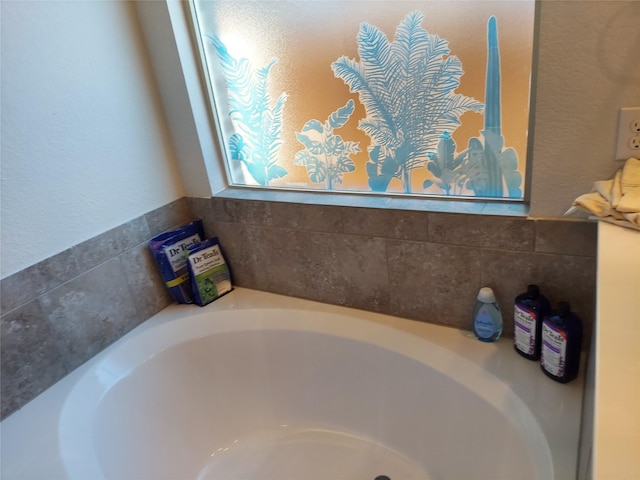 room details featuring a tub to relax in