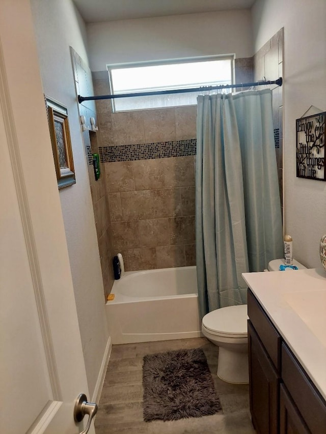 full bathroom with wood-type flooring, vanity, toilet, and shower / bath combination with curtain