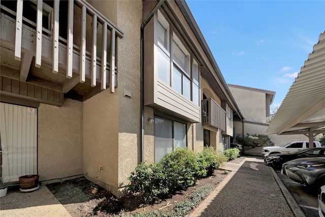 view of home's exterior with a balcony