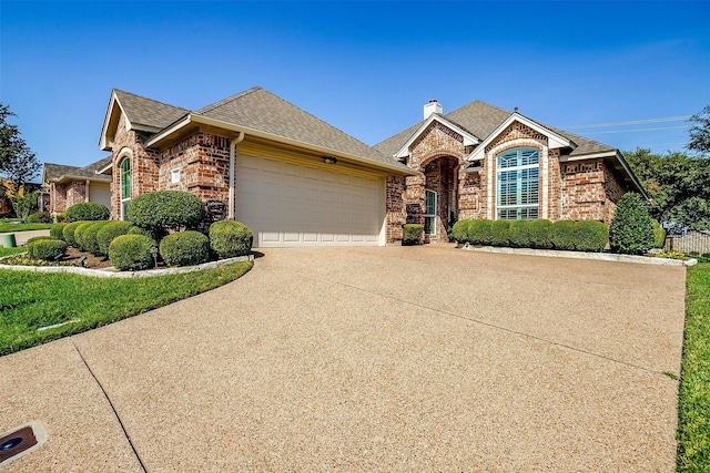 view of front of property with a garage