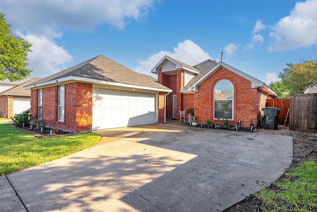 view of front of house featuring a garage and a front yard