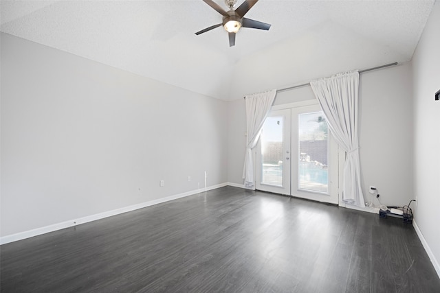 empty room featuring ceiling fan, dark hardwood / wood-style floors, a textured ceiling, french doors, and vaulted ceiling